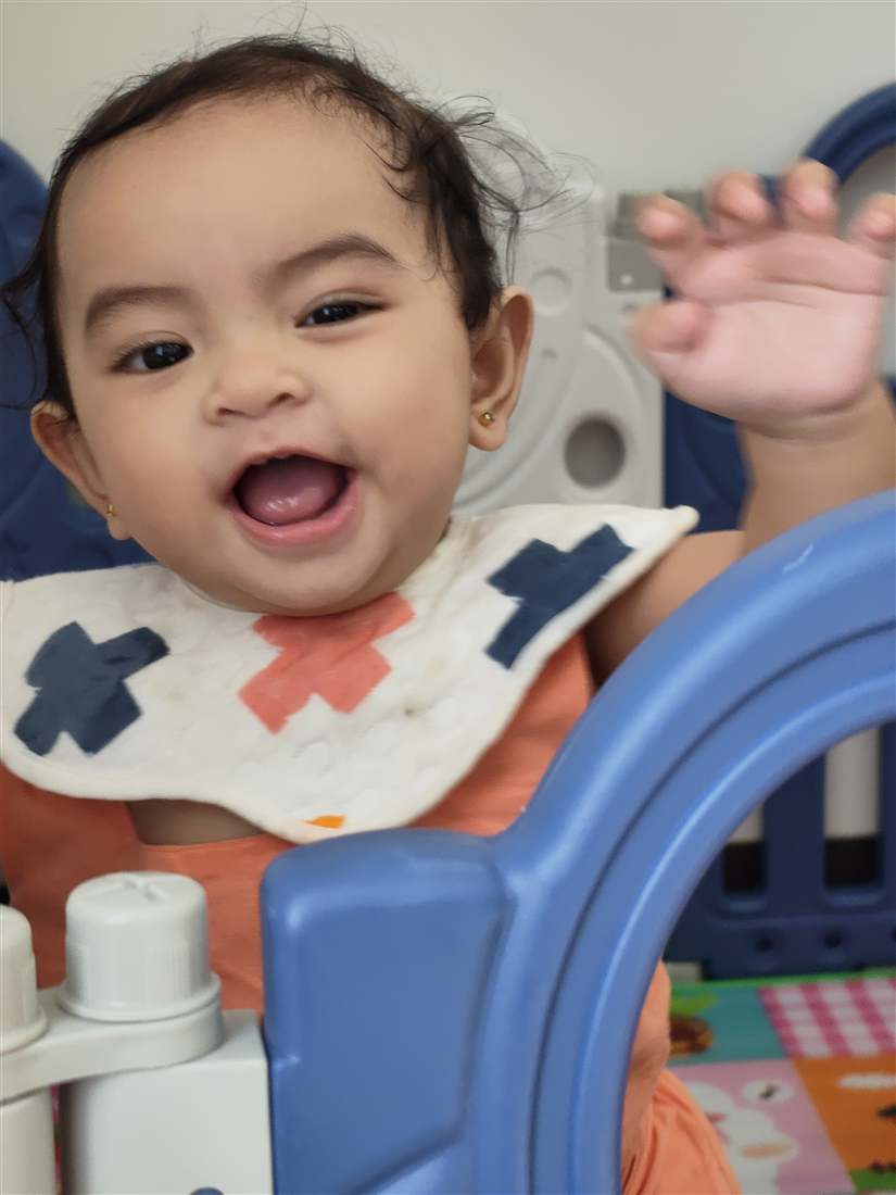 Hailee smiling and waving